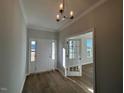 Bright foyer with wood flooring and a view into an adjacent room at 25 Accord Dr, Youngsville, NC 27596