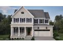Two-story home with gray brick exterior, white trim, and a two-car garage at 2618 Marchmont St, Raleigh, NC 27608