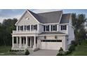 Two-story home with gray brick exterior, white trim, and a two-car garage at 2618 Marchmont St, Raleigh, NC 27608