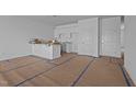 New construction kitchen with white cabinets and an island at 2995 Faucette Ln, Burlington, NC 27217