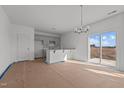 Bright dining room with kitchen access and sliding glass doors to backyard at 3615 Nc-62, Burlington, NC 27217