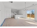 Bright dining room with kitchen and sliding glass doors at 3655 Nc-62, Burlington, NC 27217