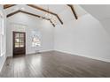 Well-lit living room showcasing hardwood floors, vaulted ceilings, and neutral wall paint at 520 S Bloodworth St, Raleigh, NC 27601