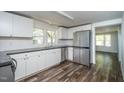 Modern kitchen features stainless steel appliances and wood flooring at 621 Shepard School Rd, Zebulon, NC 27597
