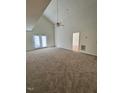Spacious living room with high ceilings and neutral carpet at 7309 Brighton Hill Ln, Raleigh, NC 27616