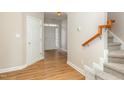 Light and bright entryway with stairs and wood-look floors at 749 Swan Neck Ln, Raleigh, NC 27615