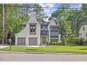 Charming two-story home boasts impeccable landscaping, a two-car garage and a welcoming front entrance at 1304 Ivy Ln, Raleigh, NC 27609