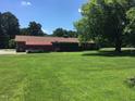Back of house showing patio and carport at 1521 Nc-87, Elon, NC 27244