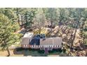 Ranch house on a wooded lot with additional structures at 3129 Barwell Rd Rd, Raleigh, NC 27610