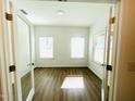 Bright office space with two large windows and wood-look flooring, perfect for working from home at 3284 Roundly Rd # 16, New Hill, NC 27562