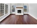 Living room with hardwood floors and a fireplace at 3321 Beech Bluff Ln, Raleigh, NC 27616