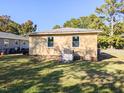 Back of house showing AC unit and grassy backyard at 509 Mullins St, Rocky Mount, NC 27803