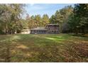Back of house, showcasing large grassy yard at 6328 Bissette Rd, Wendell, NC 27591