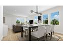 Bright dining area with large windows and seating for six at 937 Selby Ave, Durham, NC 27713