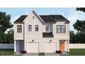 Modern farmhouse style townhouse with two-car garage and orange front door at 937 Selby Ave, Durham, NC 27713