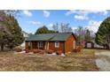 Rustic log cabin home with a spacious yard at 1018 Lakeview Dr, Cedar Grove, NC 27231