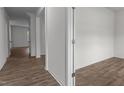 Bright hallway with light brown wood-look floors at 1025 Middlecrest Dr, Rocky Mount, NC 27804