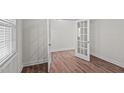 Bright office with wood-look floors and French doors at 1104 Middlecrest Dr, Rocky Mount, NC 27804
