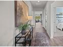 Bright hallway with hardwood floors and views into living room and bedroom at 1113 Middlecrest Dr, Rocky Mount, NC 27804