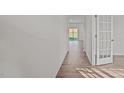 Bright hallway with light walls and wood-look flooring at 1121 Middlecrest Dr, Rocky Mount, NC 27804