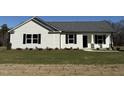 Newly built home with front yard and stone accents at 148 Phil Jack Rd, Dunn, NC 28334