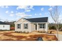 Attractive single-story home with neat landscaping, dark roof and neutral siding at 150 Brookhaven Dr, Spring Hope, NC 27882