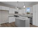 Modern kitchen features granite countertops, stainless steel appliances, and white cabinets at 150 Brookhaven Dr, Spring Hope, NC 27882