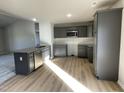 Modern kitchen with grey cabinets and granite countertops at 158 Pate Landing Dr, Selma, NC 27576