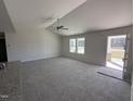 Spacious living room with vaulted ceiling, carpet, and ceiling fan at 186 Phil Jack Rd, Dunn, NC 28334
