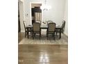 Formal dining room featuring hardwood floors and chandelier at 2001 Bunnfield Dr, Zebulon, NC 27597