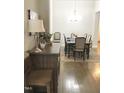 Formal dining room with hardwood floors and chandelier at 2001 Bunnfield Dr, Zebulon, NC 27597