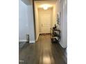 Bright entryway with hardwood floors and decorative console table at 2001 Bunnfield Dr, Zebulon, NC 27597