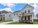 Two story home with gray siding and a welcoming front porch at 317 Umstead St, Sanford, NC 27330