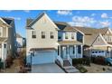 Two-story house with light beige siding, a white front door, and a brick walkway at 413 Holding Creek Dr, Wake Forest, NC 27587