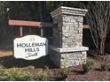 Stone sign for Holleman Hills South community entrance at 5173 Church Rd # 20, New Hill, NC 27562