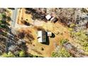 Aerial view showing house, detached garage, and surrounding land at 521 N Franklin Dr, Sanford, NC 27330