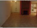 Living room with fireplace and view into kitchen at 626 Pine Ridge Pl Pl, Raleigh, NC 27609