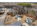 Bird's-eye view of a neighborhood with a two-story house and surrounding trees at 804 Peterson Ridge Rd, Fuquay Varina, NC 27526