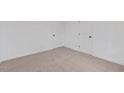 Spacious bedroom with neutral walls and carpet, plus two closets at 905 Corona St, Durham, NC 27707