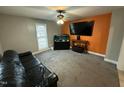 Cozy living room showcasing neutral walls, a TV, and comfortable seating at 1118 Boyer St, Raleigh, NC 27610