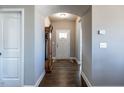 Bright and airy entryway with hardwood floors and an arched doorway at 13 Needham Ln, Clayton, NC 27527