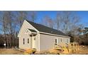 Newly built home showcasing rear view, deck, and surrounding landscape at 170 Squirrel Path Way, Roxboro, NC 27574