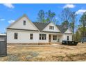 Charming new construction home with white siding, a dark roof, and bright blue sky at 250 Ellington Rd, Graham, NC 27253