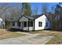 White house with black shutters and a porch at 2500 Sundial Cir, Durham, NC 27704