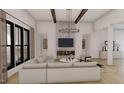 Bright living room with large windows, modern lighting, fireplace, and comfortable sofa at 2801 Mount View Church Rd, Moncure, NC 27559