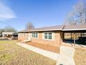 Brick ranch house with carport and landscaped yard at 314 Lawrence Street St, Roxboro, NC 27573