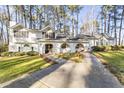 White house with a long driveway and mature trees at 3872 Hope Valley Rd, Durham, NC 27707
