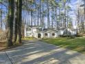 Two-story white house with a long driveway at 3872 Hope Valley Rd, Durham, NC 27707