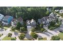 Aerial view of a neighborhood with houses and trees at 401 Streamwood Dr, Holly Springs, NC 27540