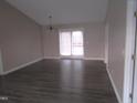 Simple dining room with hardwood floors and french doors at 409 James Toney Dr, Elon, NC 27244